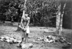 113-Busy-husking-coconuts.jpg